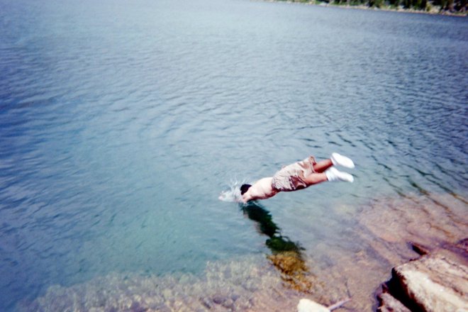 Austin Silva diving into Quiet Lake.