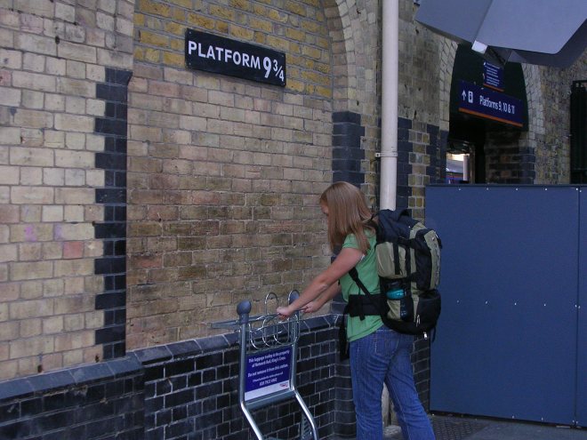 Amanda pushing her cart onto platform 9 3/4 from Harry Potter fame