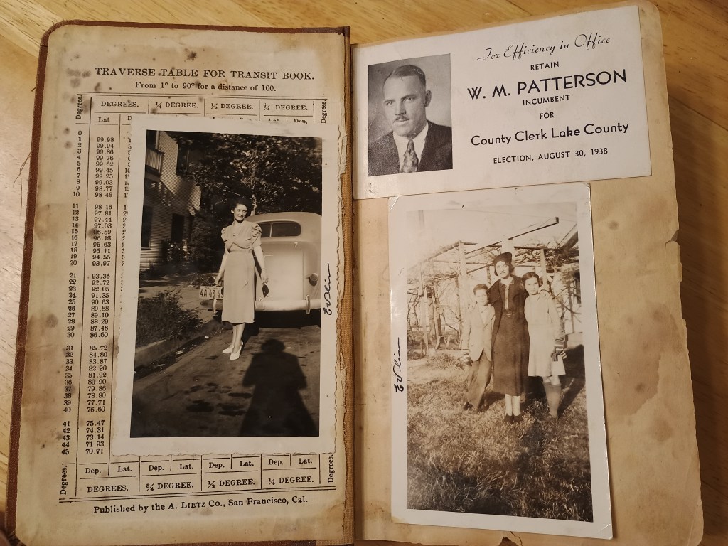 Transit table page with Evlin photographs and Patterson campaign card tucked in